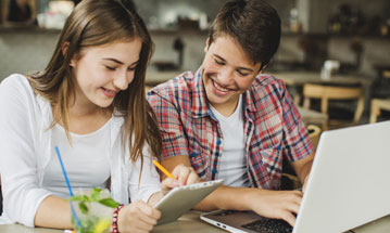 Laptop screen showing the Berlitz Catalog cover.
