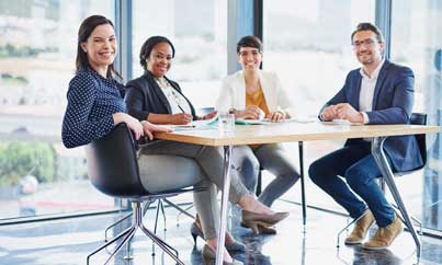 Two colleagues discussing at a desk
